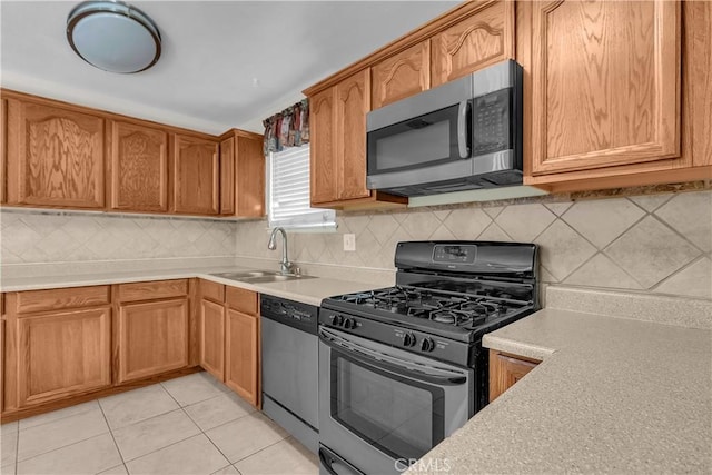 560 E Mountain View St, Barstow, CA 92311 - kitchen with appliances with stainless steel finishes, a sink, light countertops, and decorative backsplash