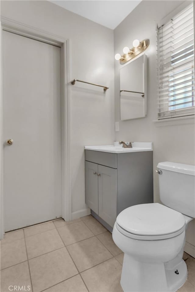 560 E Mountain View St, Barstow, CA 92311 - bathroom with vanity, tile patterned floors, and toilet