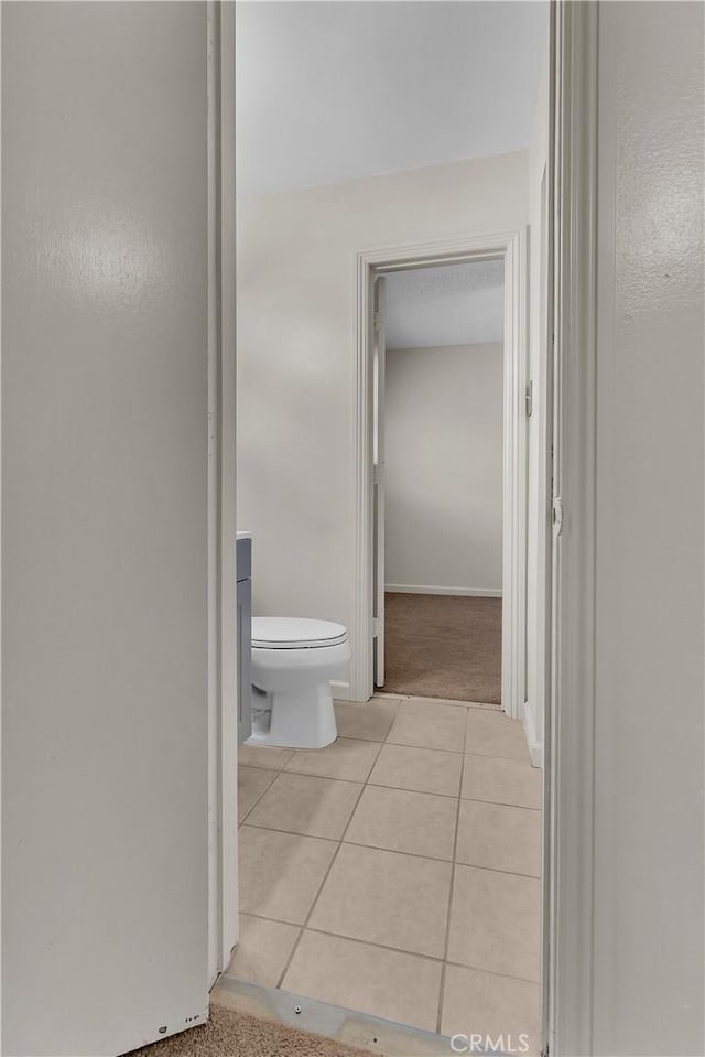 560 E Mountain View St, Barstow, CA 92311 - bathroom featuring tile patterned flooring and toilet