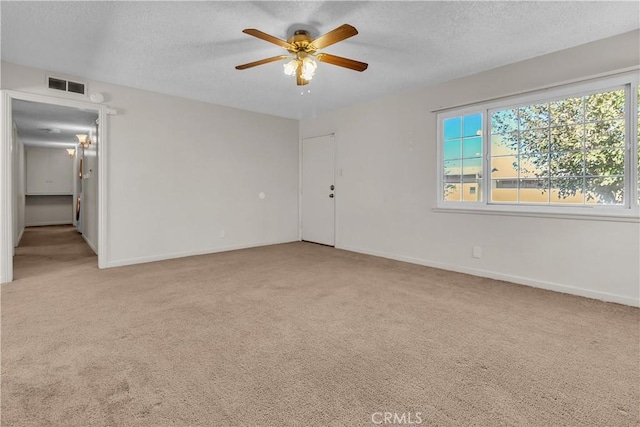 560 E Mountain View St, Barstow, CA 92311 - carpeted spare room featuring ceiling fan, a textured ceiling, and baseboards