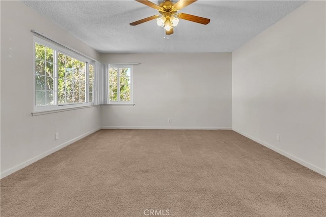 560 E Mountain View St, Barstow, CA 92311 - carpeted spare room featuring a textured ceiling, a ceiling fan, and baseboards