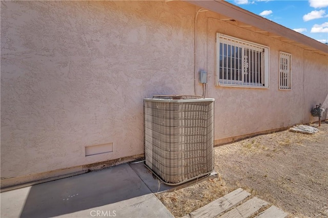 560 E Mountain View St, Barstow, CA 92311 - exterior view of central AC unit and stucco siding
