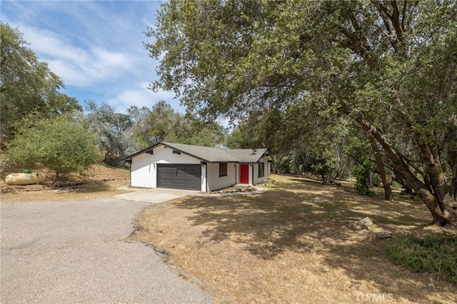 42490 Ranger Circle Way, Coarsegold, CA 93614 - view of front of home featuring asphalt driveway and a garage