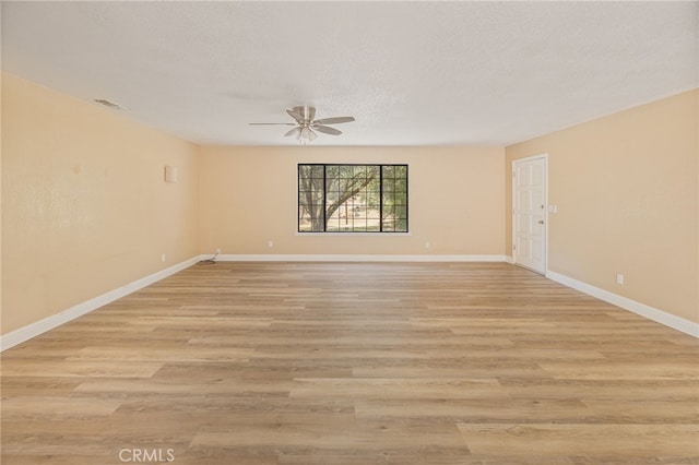 42490 Ranger Circle Way, Coarsegold, CA 93614 - unfurnished room featuring ceiling fan, baseboards, light wood-style flooring, and a textured ceiling