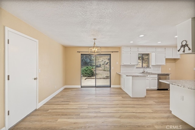 42490 Ranger Circle Way, Coarsegold, CA 93614 - kitchen featuring dishwasher, a sink, white cabinetry, light wood-style flooring, and a chandelier