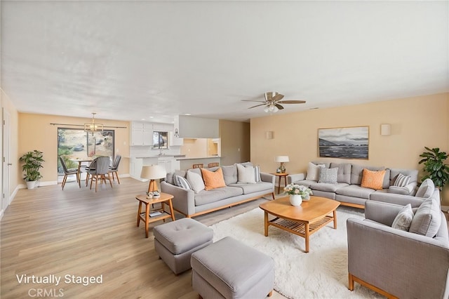 42490 Ranger Circle Way, Coarsegold, CA 93614 - living room featuring light wood finished floors, ceiling fan, and baseboards