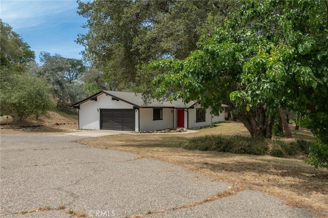 42490 Ranger Circle Way, Coarsegold, CA 93614 - view of front facade with a garage and asphalt driveway