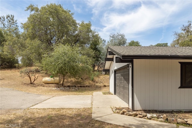 42490 Ranger Circle Way, Coarsegold, CA 93614 - view of property exterior with roof with shingles, a garage, and driveway