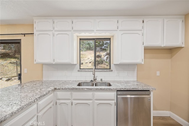 42490 Ranger Circle Way, Coarsegold, CA 93614 - kitchen featuring dishwasher, a sink, and white cabinetry