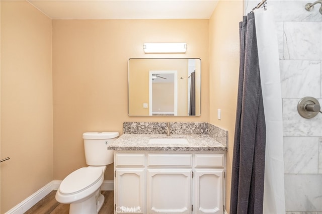 42490 Ranger Circle Way, Coarsegold, CA 93614 - full bathroom featuring toilet, wood finished floors, vanity, curtained shower, and baseboards
