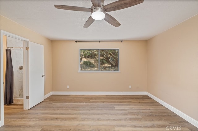 42490 Ranger Circle Way, Coarsegold, CA 93614 - unfurnished bedroom with light wood-type flooring, a textured ceiling, ceiling fan, and baseboards