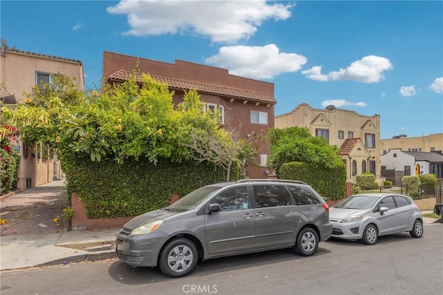 2006 S Harcourt Ave, Los Angeles, CA 90016 - view of front of property with stucco siding and a residential view