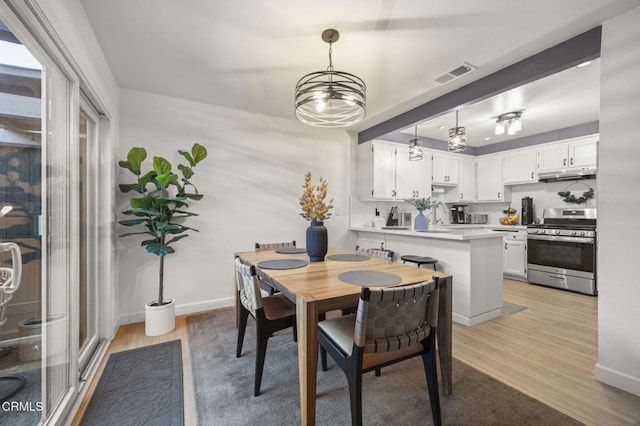 2328 N H St, Oxnard, CA 93036 - dining area featuring light wood-style floors and baseboards