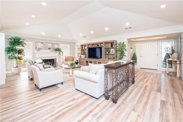 890 El Mirador, Upland, CA 91784 - living room with lofted ceiling, light wood-style flooring, a fireplace, crown molding, and recessed lighting