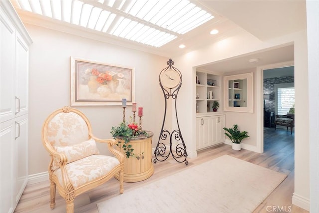 890 El Mirador, Upland, CA 91784 - sitting room with light wood finished floors, baseboards, recessed lighting, and ornamental molding