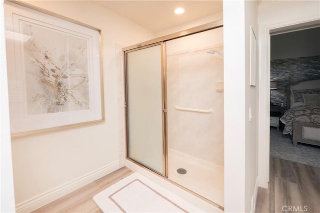 890 El Mirador, Upland, CA 91784 - bathroom with wood finished floors, a shower stall, ensuite bathroom, and recessed lighting