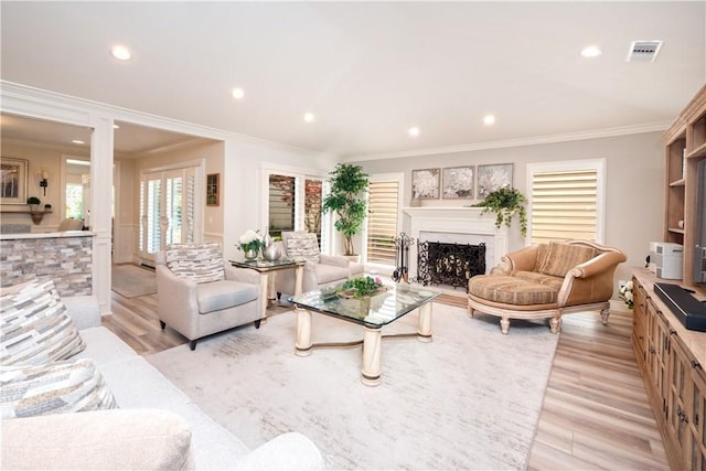 890 El Mirador, Upland, CA 91784 - living area featuring crown molding, light wood-type flooring, a fireplace, recessed lighting, and decorative columns