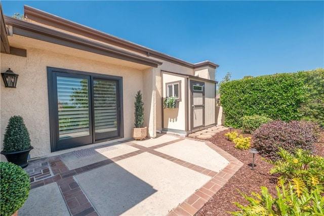 890 El Mirador, Upland, CA 91784 - property entrance with a patio and stucco siding