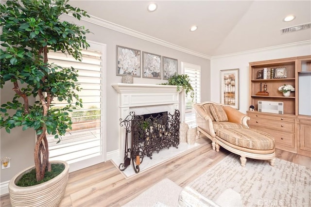 890 El Mirador, Upland, CA 91784 - sitting room featuring wood finished floors, ornamental molding, vaulted ceiling, a premium fireplace, and recessed lighting