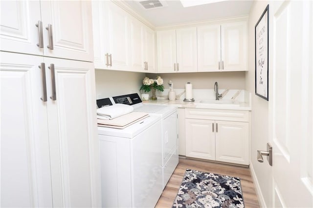 890 El Mirador, Upland, CA 91784 - laundry area featuring washing machine and dryer, cabinet space, and light wood-style flooring