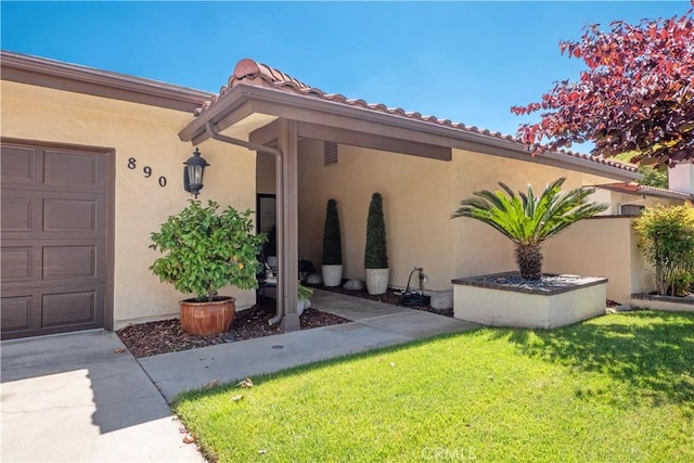 890 El Mirador, Upland, CA 91784 - doorway to property featuring stucco siding and a yard