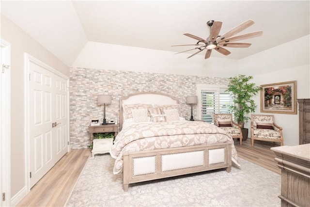 890 El Mirador, Upland, CA 91784 - bedroom with wood finished floors, vaulted ceiling, and a ceiling fan