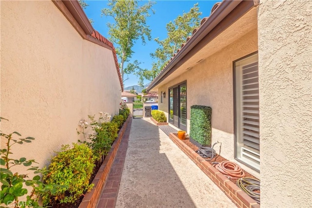 890 El Mirador, Upland, CA 91784 - view of home's exterior with stucco siding and a gate