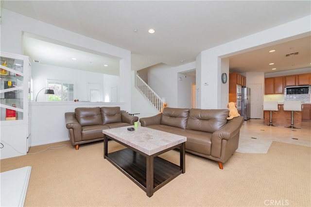 15752 Mimosa Ct, Fontana, CA 92336 - living room with recessed lighting, stairs, and light colored carpet