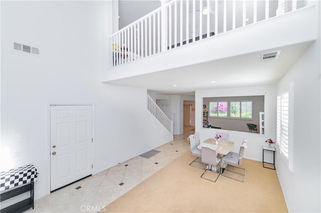 15752 Mimosa Ct, Fontana, CA 92336 - dining space featuring stairway, a high ceiling, and tile patterned flooring