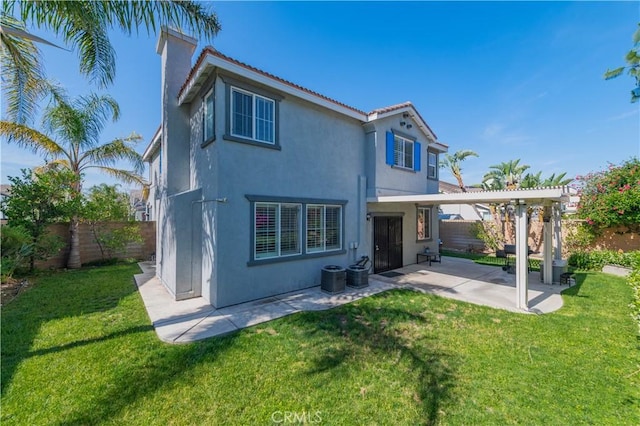 15752 Mimosa Ct, Fontana, CA 92336 - rear view of house featuring stucco siding, a patio, a chimney, and a tiled roof