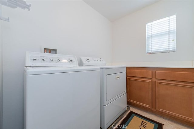 15752 Mimosa Ct, Fontana, CA 92336 - washroom with washer and clothes dryer, cabinet space, and light tile patterned floors