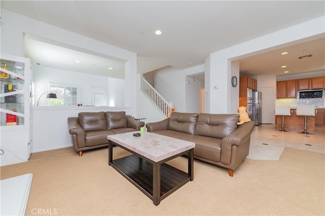 15752 Mimosa Ct, Fontana, CA 92336 - living room with recessed lighting, stairs, and light carpet