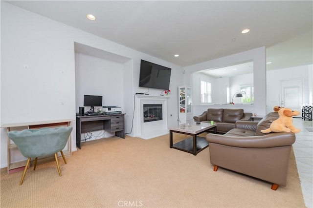 15752 Mimosa Ct, Fontana, CA 92336 - living room with a glass covered fireplace, recessed lighting, and light carpet