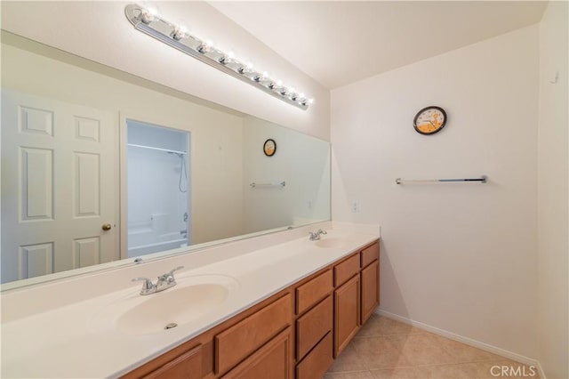15752 Mimosa Ct, Fontana, CA 92336 - full bath with double vanity, tile patterned floors, baseboards, and shower / bath combination