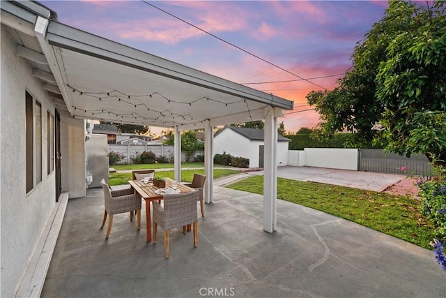 patio terrace at dusk with outdoor dining space