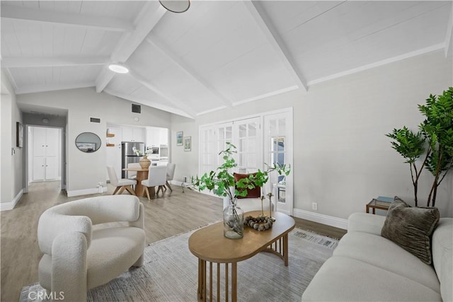 living area with light wood-style floors and baseboards
