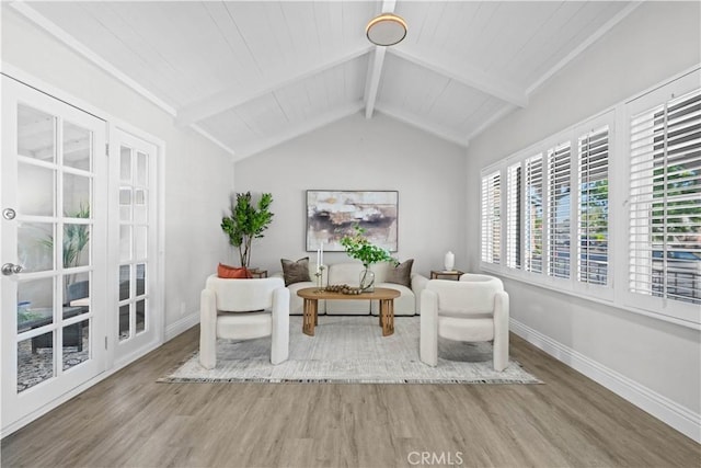 living area featuring wood finished floors and baseboards