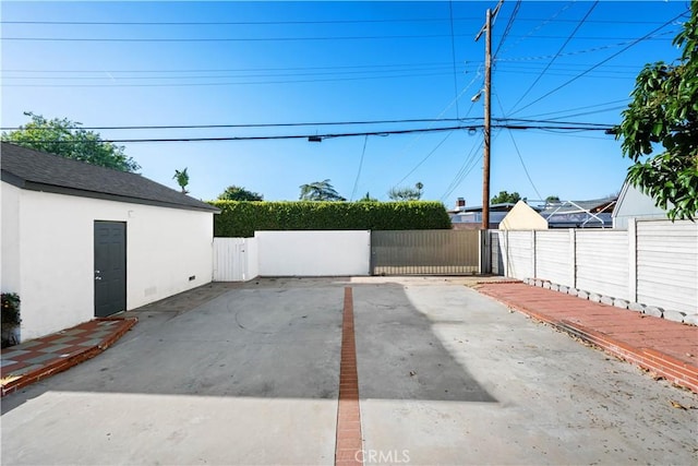 view of patio / terrace featuring fence and a gate