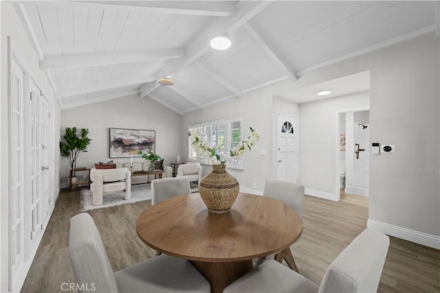 dining room with light wood finished floors and baseboards