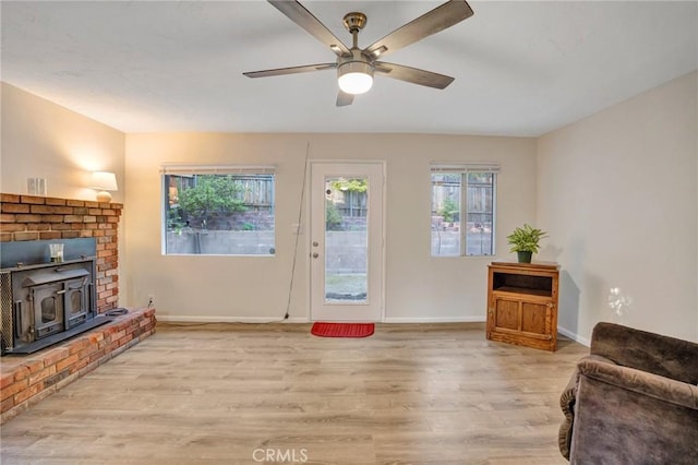 32159 Cove Cir, Running Springs, CA 92382 - living room featuring light wood-style floors, baseboards, and ceiling fan