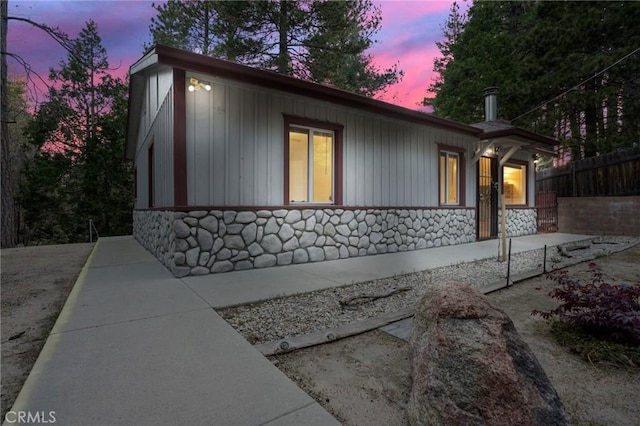 32159 Cove Cir, Running Springs, CA 92382 - view of home's exterior featuring stone siding and board and batten siding