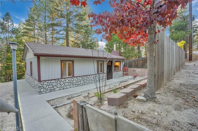 32159 Cove Cir, Running Springs, CA 92382 - view of front of house with stone siding and a shingled roof