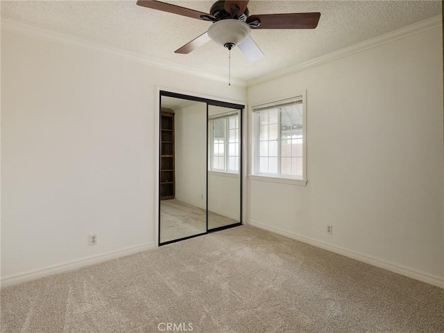 1715 W Santa Cruz St, San Pedro, CA 90732 - unfurnished bedroom with light colored carpet, a textured ceiling, ornamental molding, a closet, and baseboards