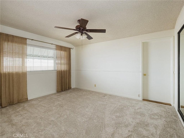 1715 W Santa Cruz St, San Pedro, CA 90732 - empty room with a textured ceiling, a ceiling fan, carpet, and baseboards