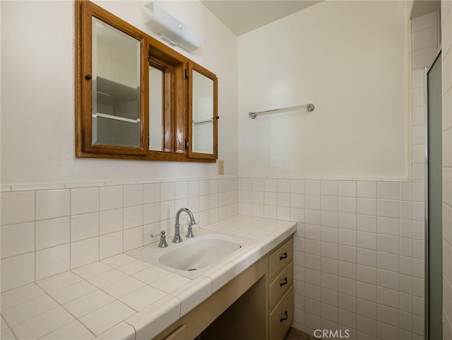 1715 W Santa Cruz St, San Pedro, CA 90732 - bathroom featuring tile walls, vanity, and wainscoting