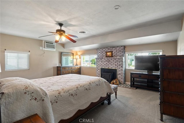 253 Gurnsey Dr, Red Bluff, CA 96080 - carpeted bedroom featuring a fireplace, a ceiling fan, and a wall mounted AC