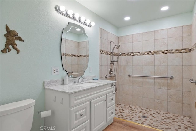 253 Gurnsey Dr, Red Bluff, CA 96080 - full bath with a tile shower, toilet, vanity, and wood finished floors