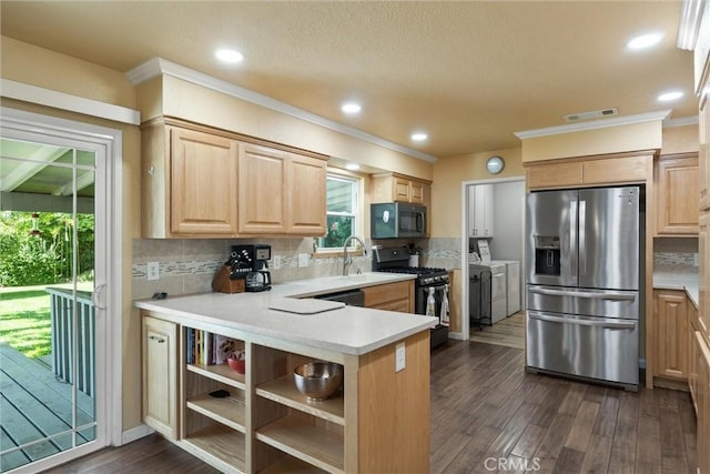 253 Gurnsey Dr, Red Bluff, CA 96080 - kitchen featuring black appliances, independent washer and dryer, a sink, light brown cabinets, and decorative backsplash