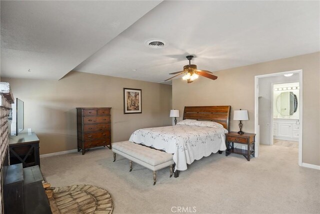 253 Gurnsey Dr, Red Bluff, CA 96080 - bedroom with light carpet, baseboards, and a wood stove