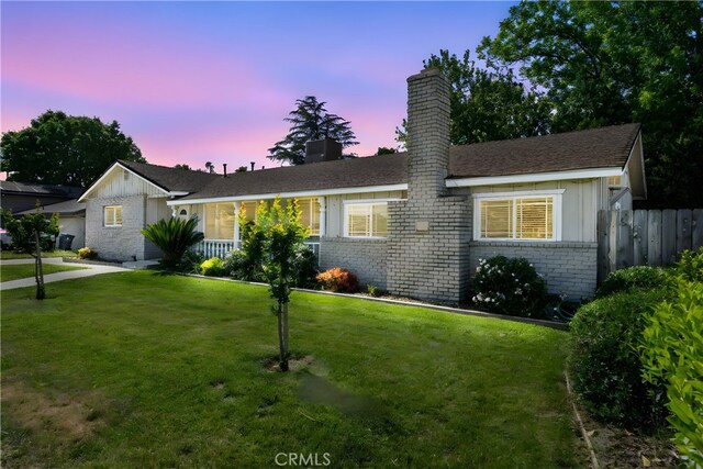 253 Gurnsey Dr, Red Bluff, CA 96080 - single story home with board and batten siding, brick siding, and a chimney